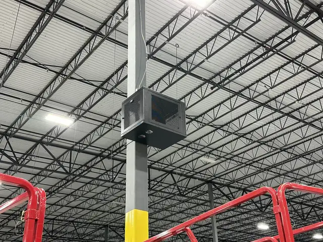 Enclosure on warehouse column from boom lift