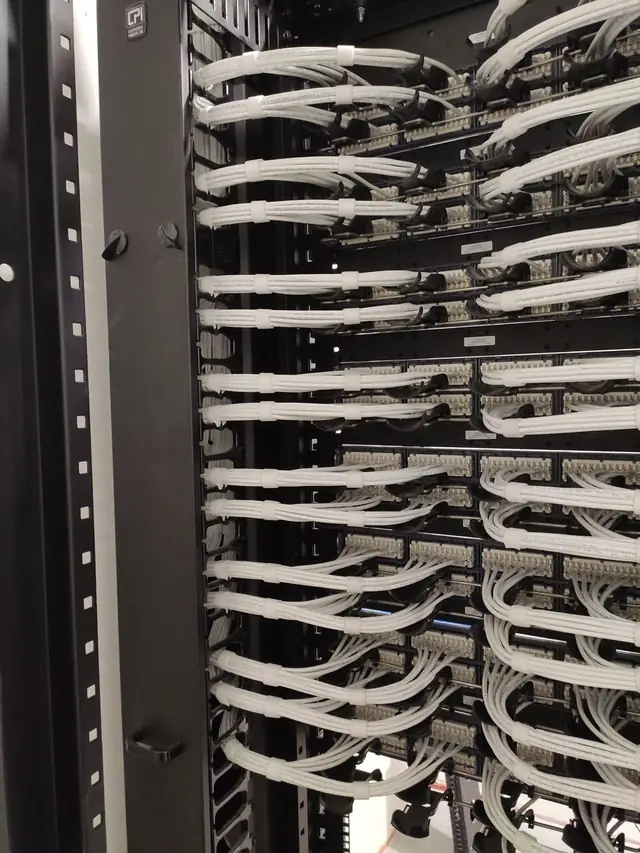 Rear of patch panels with white Cat6A