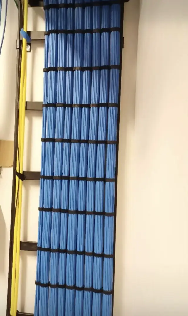 Vertical drop of blue Cat6 bundle