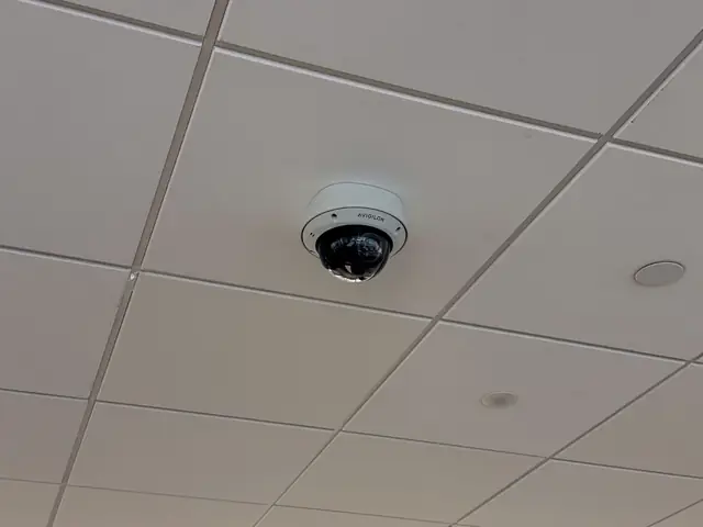 Avigilon dome camera flush-mounted in an office ceiling